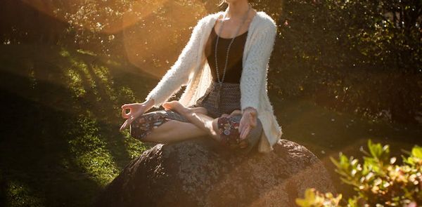A person sitting in a calm meditative pose.